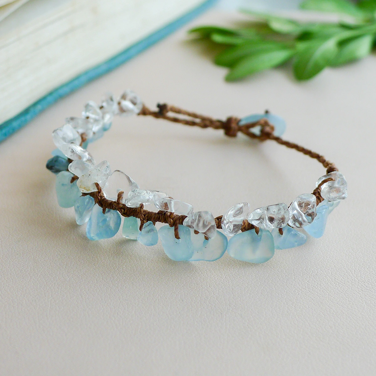 Brown waxed cord detail on handmade aquamarine and clear quartz bracelet